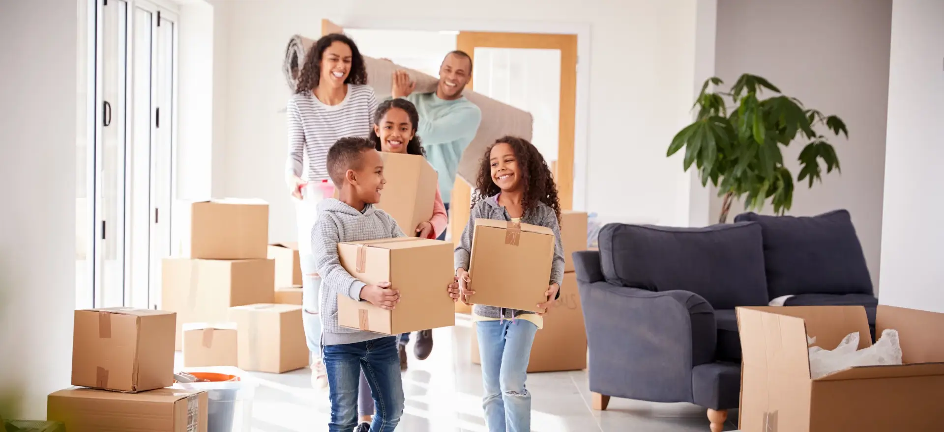 Happy family moving in to their new home thanks to i3 Mortgage, LLC